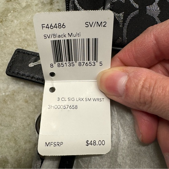 NWT!! Coach wristlet, still in packaging!! Black, silver, and grey. Smoke free - Picture 4 of 9